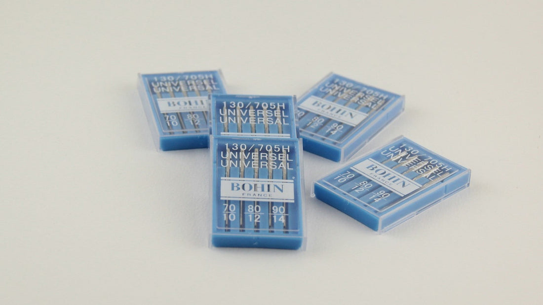 Aiguilles universelles Bohin pour machine à coudre, idéales pour divers tissus.