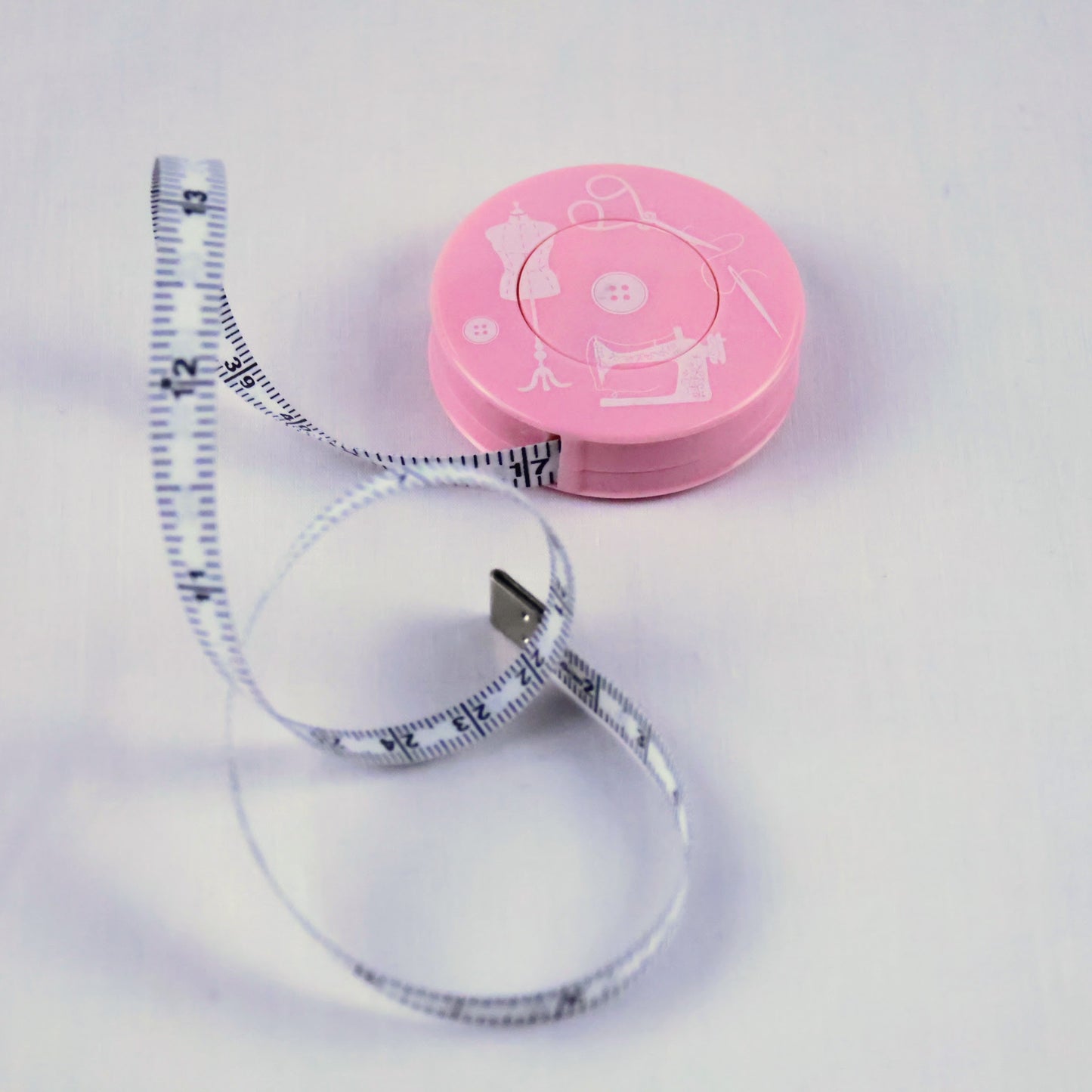 Mètre ruban de couture rétractable rose