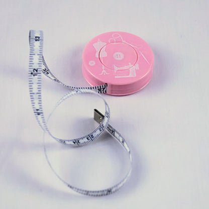 Mètre ruban de couture rétractable rose