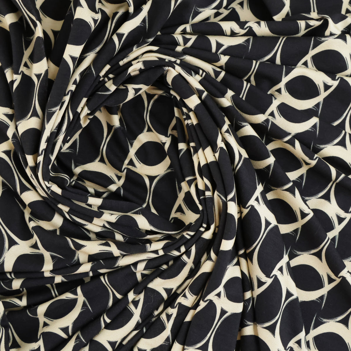 Jersey tourbillon beige sur fond noir