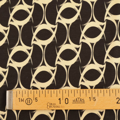 Jersey tourbillon beige sur fond noir